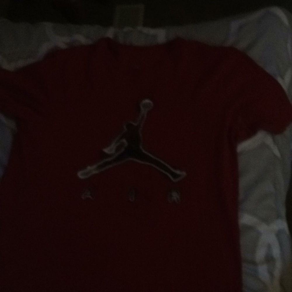 A red Jordan shirt
